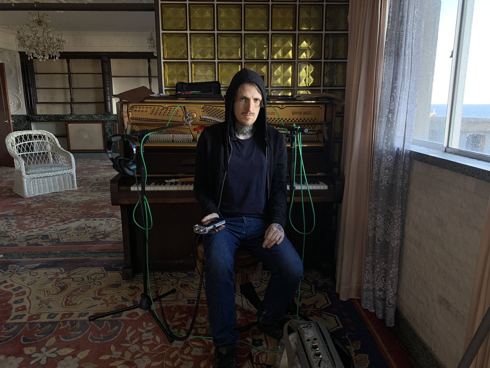 Alexey Seliverstov with an abandoned Yamaha upright piano